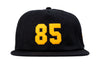 Odyssey '85 5-Panel Hat (Black w/ Golden Rod Felt Applique)